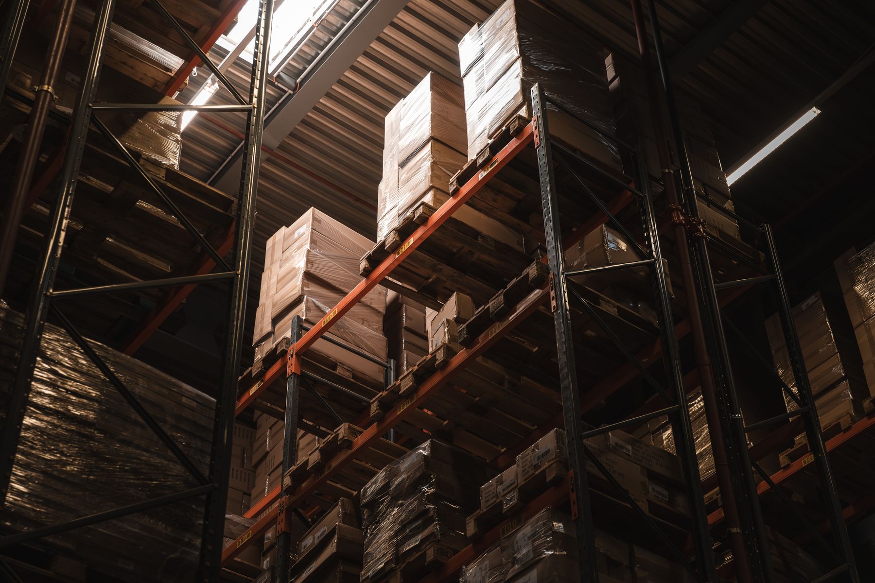 Cartons stored on warehouse pallet racks